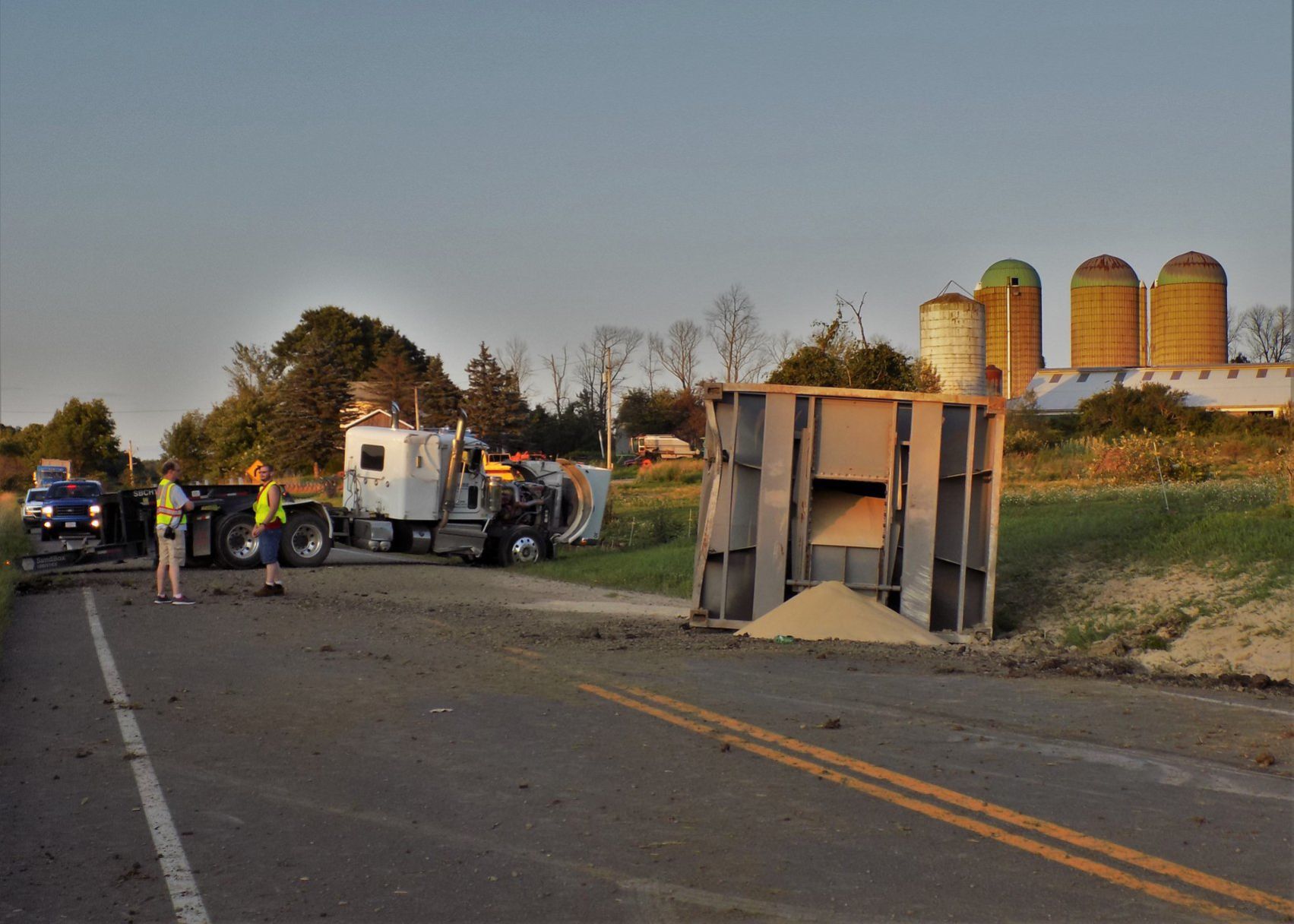 Sand truck overturns on 660